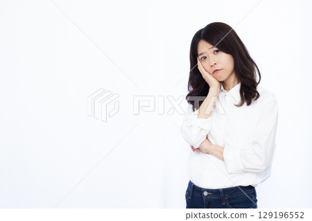 A woman who is seriously worried A woman who is seriously worried 129196552