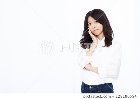 A woman who is seriously worried A woman who is seriously worried 129196554