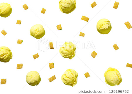 Yellow ice cream scoops with candies, isolated on white, PNG 129196762