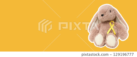 Cute stuffed bunny toy with a cheerful yellow ribbon on display Cute stuffed bunny toy with a cheerful yellow ribbon on display 129196777