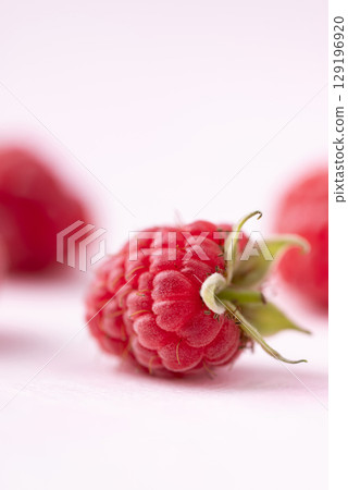 Fresh ripe raspberry with leaf on pink background, Summer fruit Fresh ripe raspberry with leaf on pink background, Summer fruit 129196920