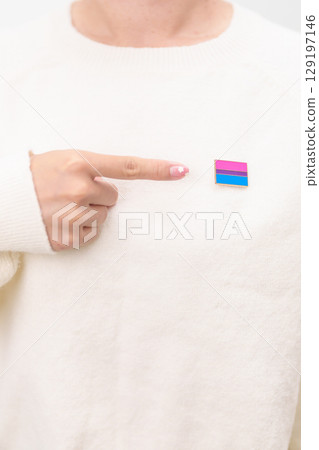 Bisexuality Celebrate Day and LGBT pride month, LGBTQ or LGBTQIA concept. Hand holding purple, pink and blue flag shape for Lesbian, Gay, Bisexual, Transgender, Queer, Pansexual, Marriage Equality Law 129197146