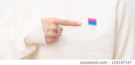 Bisexuality Celebrate Day and LGBT pride month, LGBTQ or LGBTQIA concept. Hand holding purple, pink and blue flag shape for Lesbian, Gay, Bisexual, Transgender, Queer, Pansexual, Marriage Equality Law 129197147