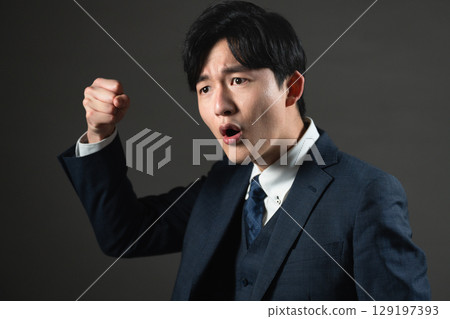 Young man in a suit Business image 129197393