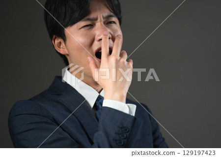 Young man in a suit Business image 129197423