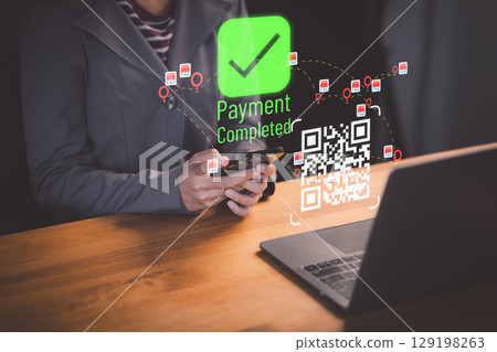 Female client using smartphone to scan QR code to make payment. Customer making payment through mobile phone and scan code for online shopping. Secure online payment, Digital banking. 129198263