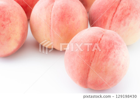 Close-up of peach (Akatsuki) on white background Close-up of peach (Akatsuki) on white background 129198430