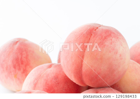 Close-up of peach (Akatsuki) on white background Close-up of peach (Akatsuki) on white background 129198433