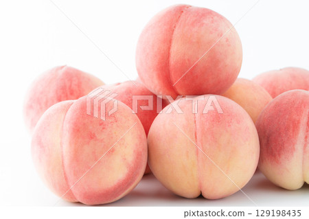 Close-up of peach (Akatsuki) on white background Close-up of peach (Akatsuki) on white background 129198435