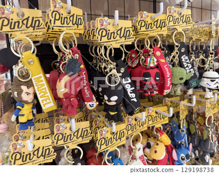 Keychains display featuring various popular characters in Penang's souvenir shop 129198738