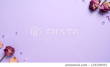 Bead and petal decoration on lavender background 129199441