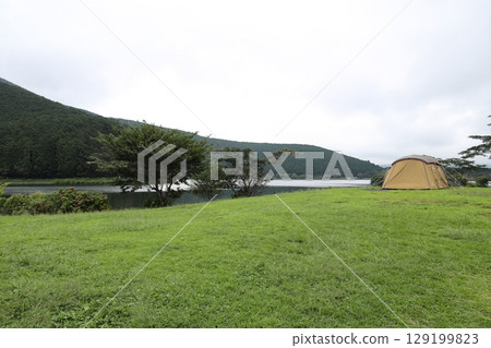 A large tent set up at a campsite on the shores of Lake Tanuki, Fujinomiya City, Shizuoka Prefecture A large tent set up at a campsite on the shores of Lake Tanuki, Fujinomiya City, Shizuoka Prefecture 129199823