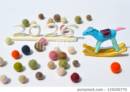 Paper clay rocking horse and felt ball New Year's materials 129200770