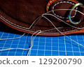 The process of leather processing, making a seam 129200790