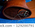 The process of leather processing, making a seam 129200791