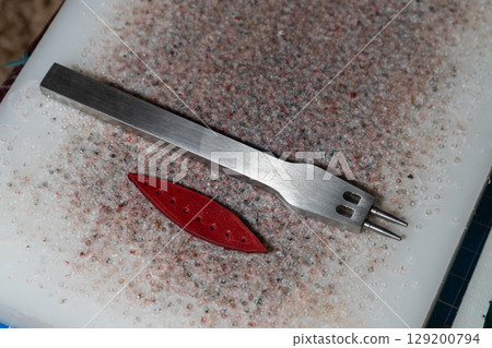The process of leather processing, making a seam The process of leather processing, making a seam 129200794