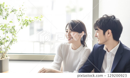 Men and women talking in a casual setting 129200923