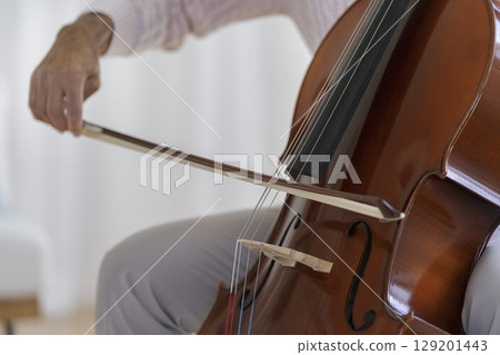Senior man playing the cello Senior man playing the cello 129201443