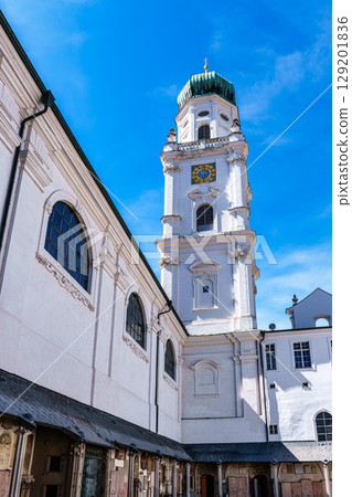 St. Stephans cathedral in Passau, Germany is an old white church with green metal domes on top of the towers St. Stephans cathedral in Passau, Germany is an old white church with green metal domes on top of the towers 129201836