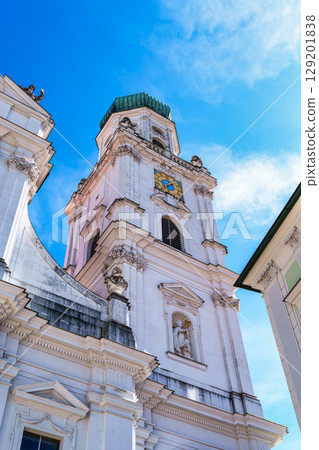 St. Stephans cathedral in Passau, Germany is an old white church with green metal domes on top of the towers St. Stephans cathedral in Passau, Germany is an old white church with green metal domes on top of the towers 129201838