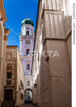 St. Stephans cathedral in Passau, Germany is an old white church with green metal domes on top of the towers St. Stephans cathedral in Passau, Germany is an old white church with green metal domes on top of the towers 129201839