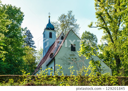 Church St.Clemens in Kranzberg near Freising, Bavaria with ancient graveyard and beautiful old wrought iron crosses Church St.Clemens in Kranzberg near Freising, Bavaria with ancient graveyard and beautiful old wrought iron crosses 129201845