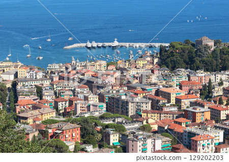Camogli, Italy - 11 July 2025. Yachts, boats in bay of Liguria. Sea and tourism in Italy. Traditional buildings. Background for design. 129202203