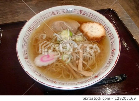 Akita Ramen: Thin, curly noodles aged at low temperature for a firm texture and a soy sauce flavor based on bonito stock and dried sardines. 129203169