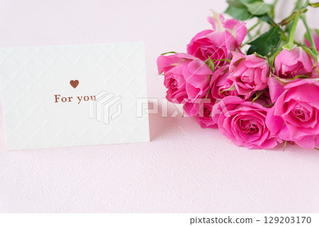 A bouquet of roses and a message card saying "for you" A bouquet of roses and a message card saying "for you" 129203170