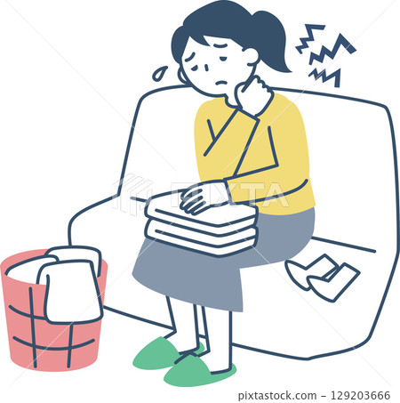 A woman suffering from stiff shoulders while folding laundry 129203666