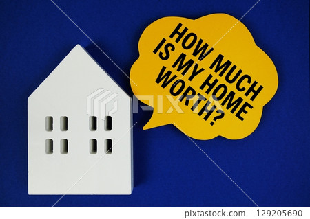 How Much Is My House Worth text on speech bubble and house model on blue background 129205690