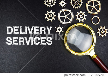 Delivery Services text message with magnifying glass on black background Delivery Services text message with magnifying glass on black background 129205700