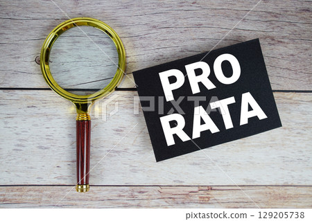 Pro Rata text written on paper with magnifying glass 129205738