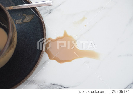 Coffee spilled on marble counter after breakfast 129206125