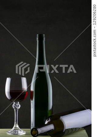 Still life with glasses of wine and glass bottle Still life with glasses of wine and glass bottle 129206280