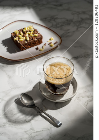 Black hot coffee in a glass, sunlight, lifestyle photo Black hot coffee in a glass, sunlight, lifestyle photo 129206493