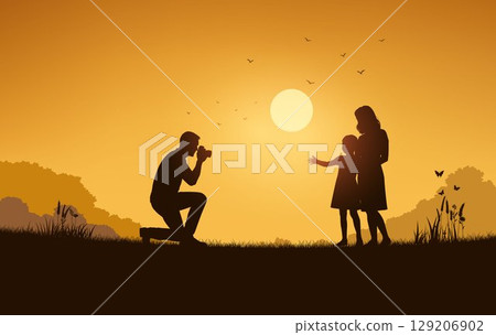 Father Photographing Mother and Daughter at Sunset 129206902