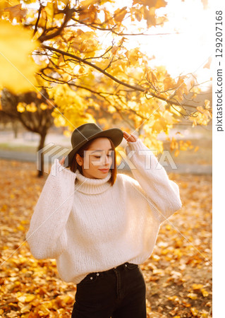 Young woman resting in nature. Fashion, style concept. People, lifestyle, relaxation and vacations. Young woman resting in nature. Fashion, style concept. People, lifestyle, relaxation and vacations. 129207168
