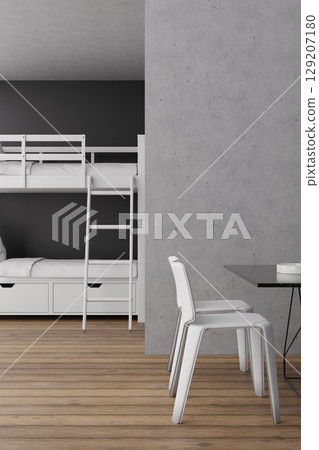 This hostel interior showcases a functional layout with a bunk bed setup, a simple dining table, and wooden flooring. A sleek, minimalist aesthetic enhances the inviting atmosphere for travelers 129207180
