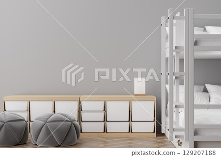 Stylish hostel interior showcases a minimalist design with cozy bunk beds, soft seating, and efficient storage. This inviting space is perfect for social travelers seeking comfort and community 129207188