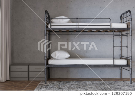 Bunk beds arranged in a stylish hostel interior, complemented by neutral walls and wooden flooring. A tidy and inviting atmosphere perfect for travelers seeking comfort and convenience 129207190