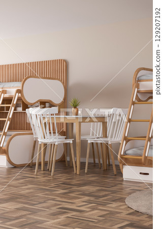 Stylish hostel interior showcases a welcoming atmosphere with modern wooden bunk beds and a simple dining table set. Natural light enhances the inviting space, ideal for socializing 129207192