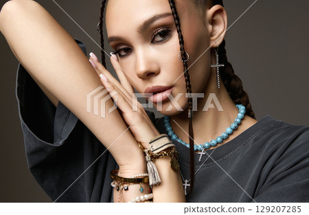 beautiful girl with braids and many bijouterie accessories 129207285