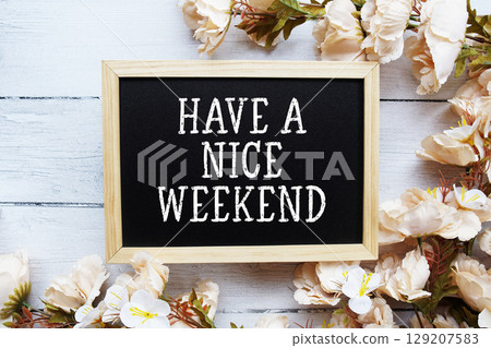Have a Nice Weekend text with flower decoration on wooden background Have a Nice Weekend text with flower decoration on wooden background 129207583