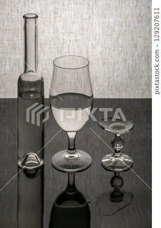 Still life with glassware and a broken glass 129207611