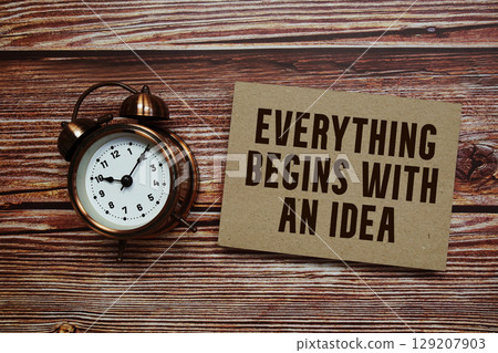 Everything Begins with an Idea text with alarm clock on wooden background 129207903