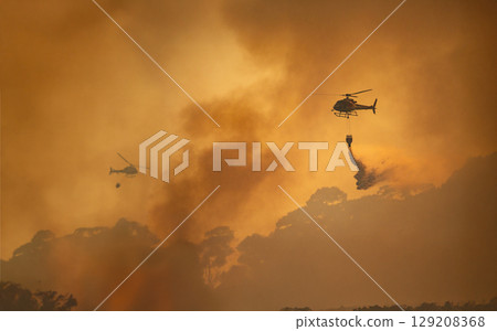 Fire fighting helicopter carry watethar bucket to extinguish the forest fire. 129208368