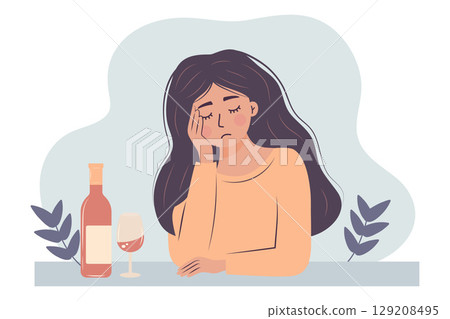 Sad woman sits at table with bottle and glass of wine. Alcohol abuse depression problem of female. Sad woman sits at table with bottle and glass of wine. Alcohol abuse depression problem of female. 129208495