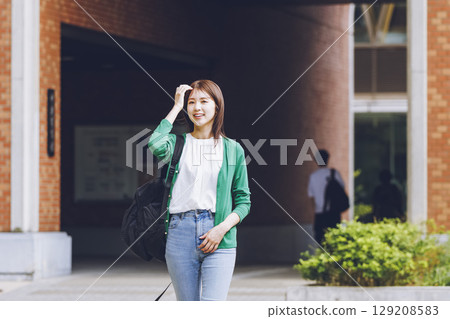 Female students walking on campus Female students walking on campus 129208583