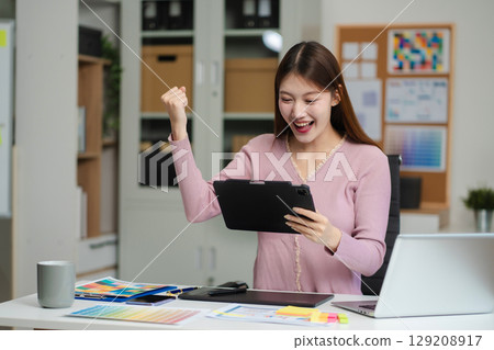 Successful web designers, excellent woman and success at the office. Successful web designers, excellent woman and success at the office. 129208917